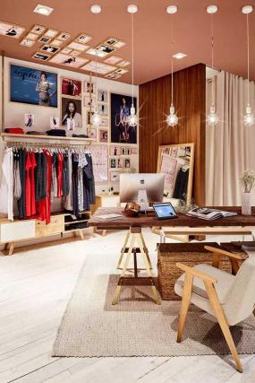 女服装店室内背景墙壁纸装修效果图片